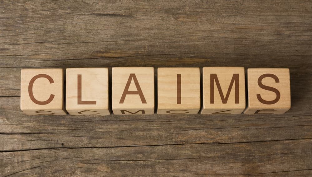 CLAIMS word in vintage wooden blocks