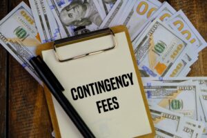 Contingency Fees word written on a paper with money in background